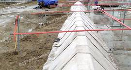 Bund construction for a tank farm using concrete canvas