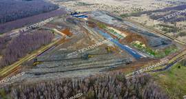 Construction of a reinforced-soil retaining wall and grading of landfill slopes using geosynthetics by «ТЕХПОЛИМЕР»