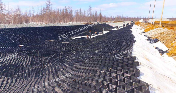 Experience in Designing and Constructing Drainage Channels in Permafrost Areas