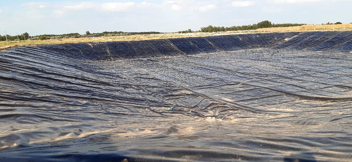 Construction of a storage lagoon at a livestock farm