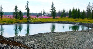 Experience in Designing and Constructing Drainage Channels in Permafrost Areas
